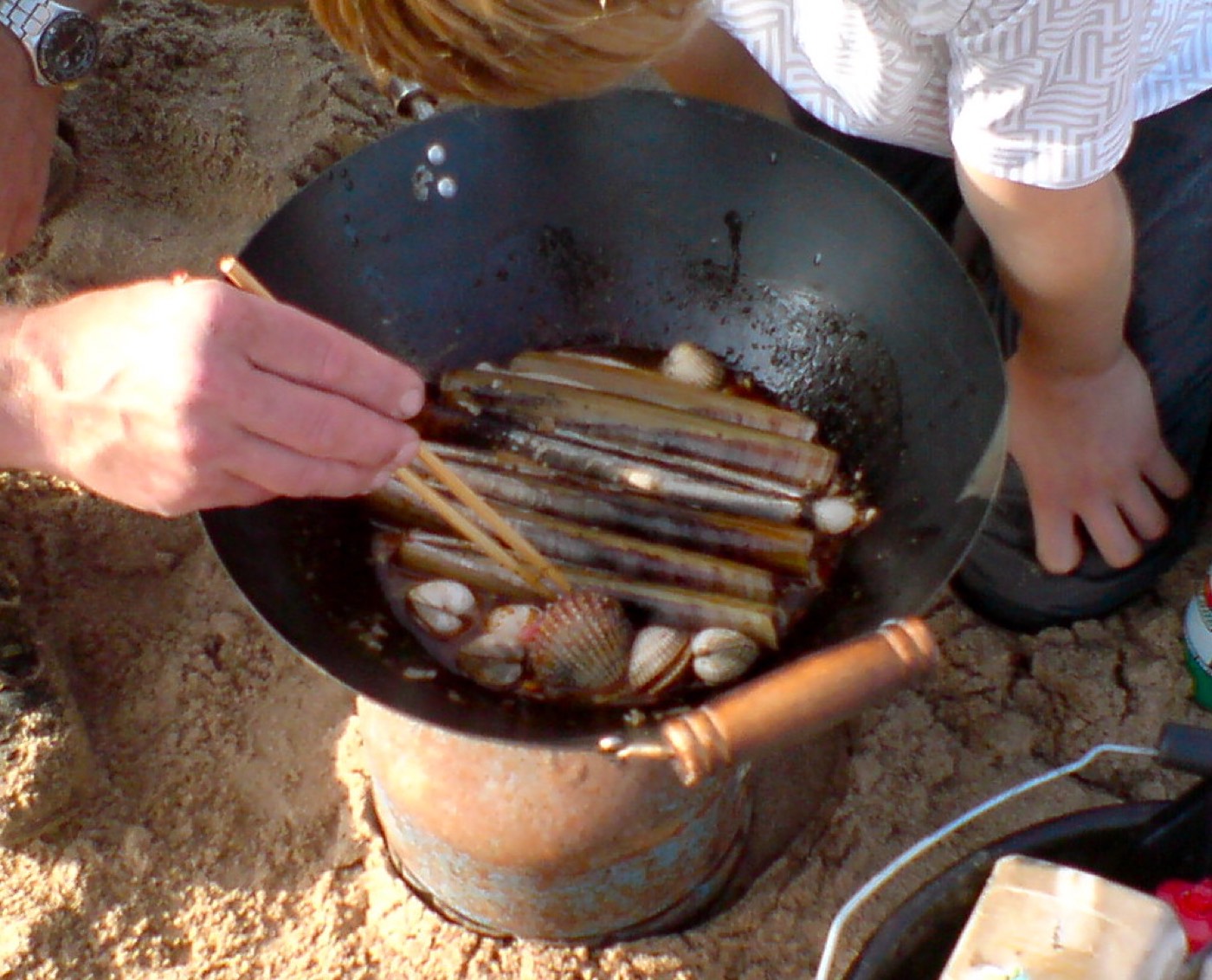 Cooking in a pan over an open fire