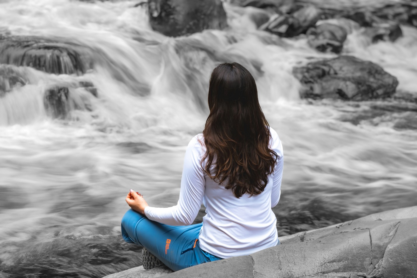 Meditation beside a rocky stream